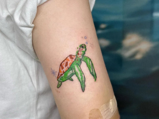 Small Watercolor Turtle with Bubbles Tattoo on Women Arm by @tattooist_ongsim