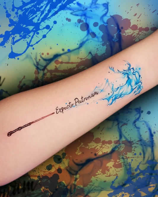 Small Watercolor Wand and Expecto Patronum on Women Arm Tattoo by @baltapaprocki.tattoo