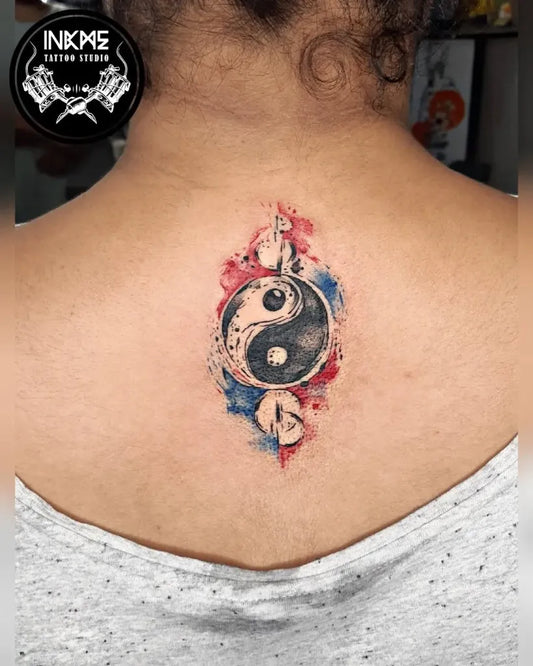 Small Watercolor Yin Yang Tattoo on Women Back by @inkme_tattoostudios