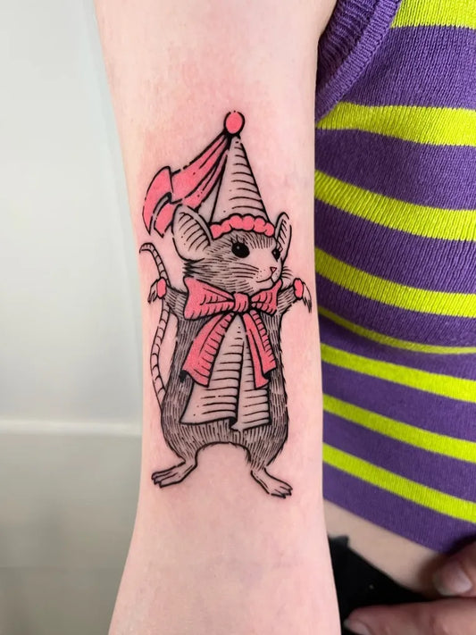 Small Woodcut Circus Mouse Tattoo on Women Arm by @ratdungeontattoo