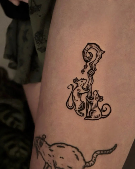 Small Woodcut Mice and Question Staff Tattoo on Women Thigh by @oosatattoo