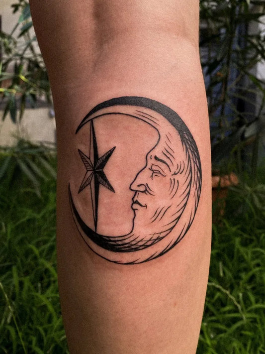 Small Woodcut Moon and Star Tattoo on Women Arm by @rigest_d