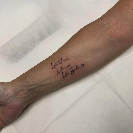 Small Word Let Them on Women Wrist Tattoo by @liliinkstudio