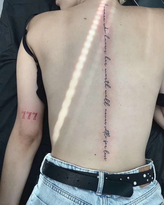 Small Word Quote on Women Spine Tattoo by @ninitattoo_mariborink