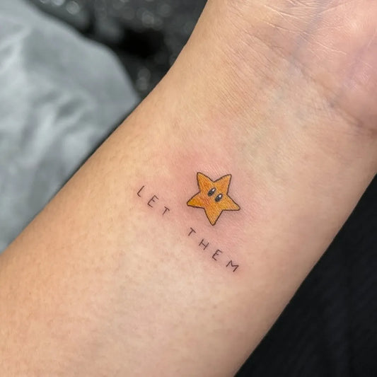 Small Yellow Star Let Them Tattoo on Women Wrist by @wittybutton_tattoo