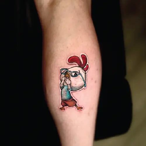 cute chicken little sticker style tattoo on calf