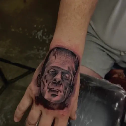 Frankenstein portrait hand tattoo