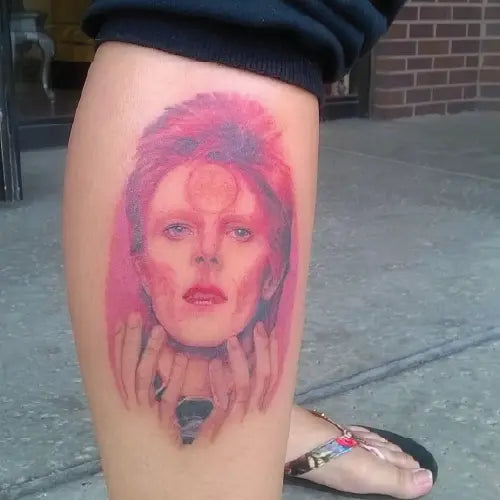 David Bowie pink portrait leg tattoo