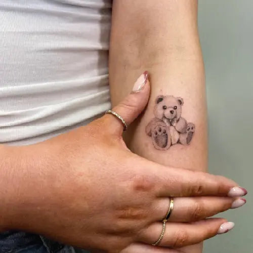 realistic teddy bear arm tattoo