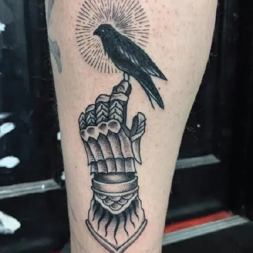 traditional Thanos glove hand black bird tattoo