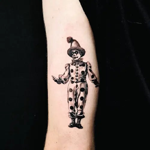 realistic clown joker black and grey arm tattoo