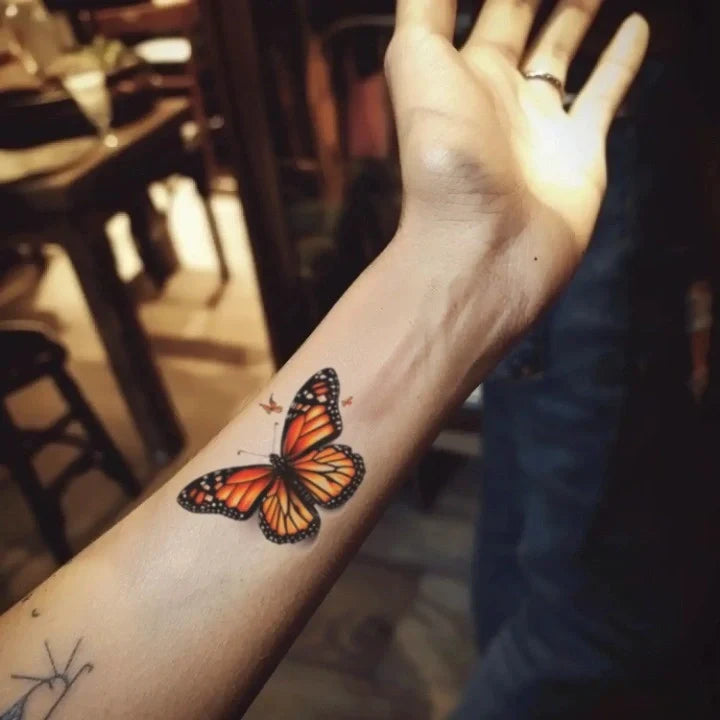 realistic butterfly forearm temporary tattoo idea design
