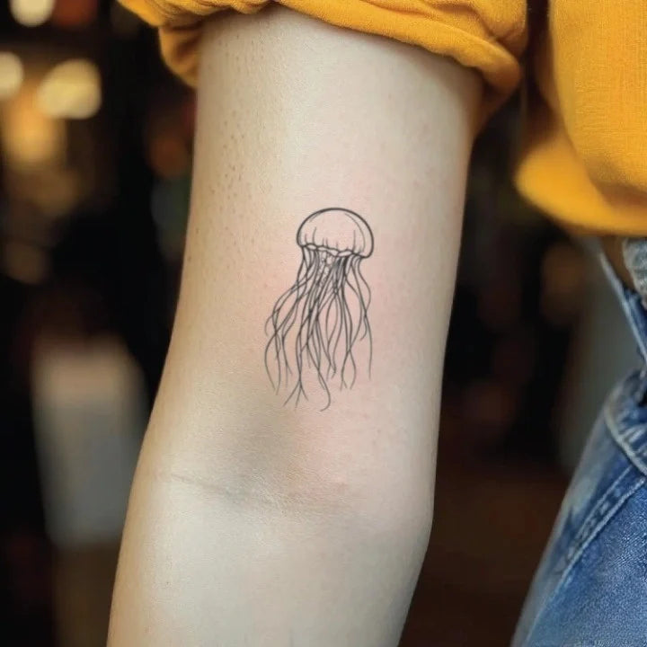 fine line jellyfish bicep temporary tattoo idea design