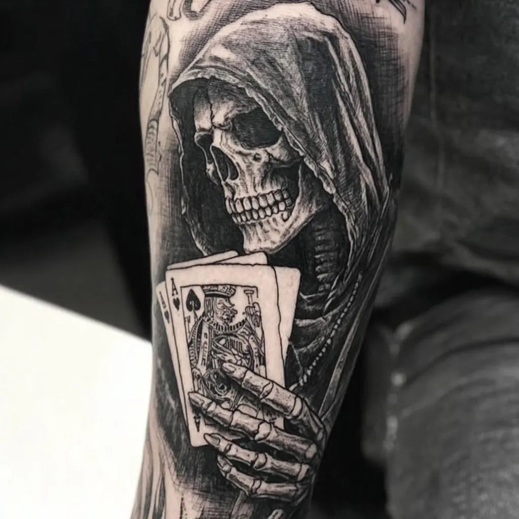 grim reaper dead man's hand tattoo on forearm