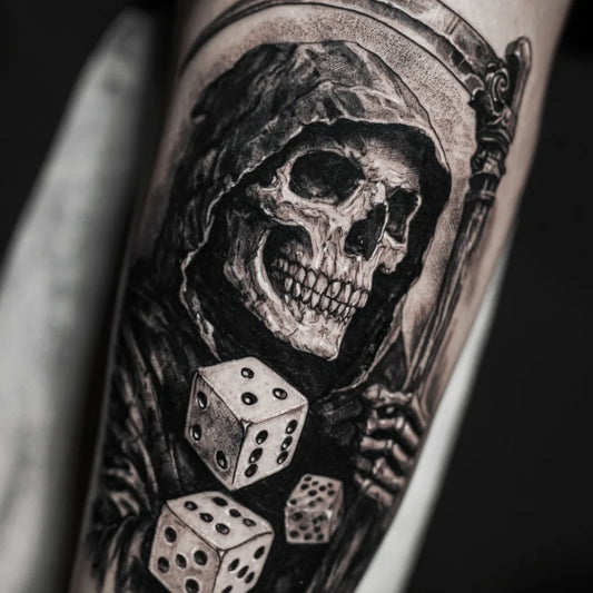 grim reaper dice tattoo on forearm