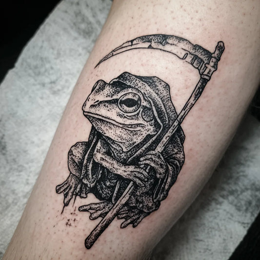 grim reaper frog tattoo on forearm