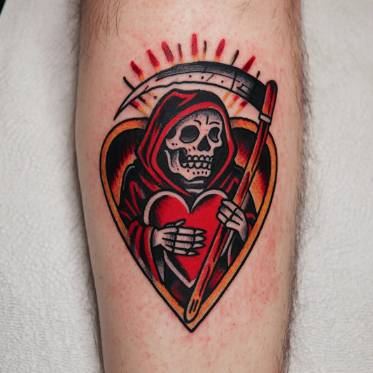 grim reaper heart tattoo on forearm