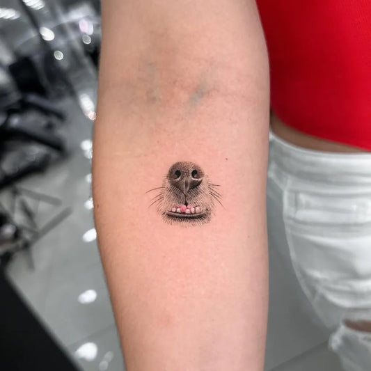 Tiny Black and Grey Dog Nose Tattoo on Women Arm by @maytattoo17
