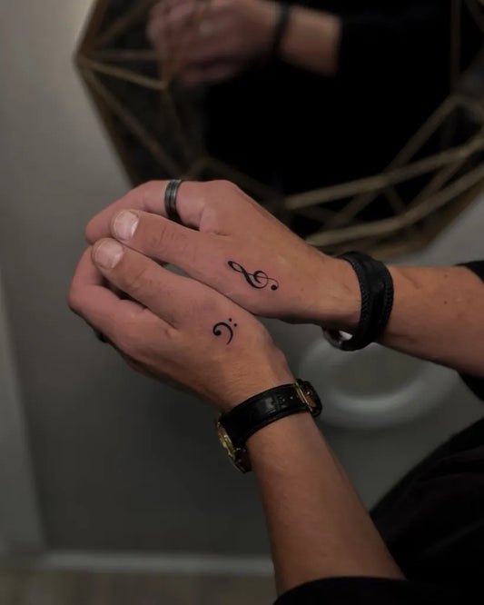 Tiny Black and Grey Musical Notes Tattoo on Men Hand by @truskawa.tattoo