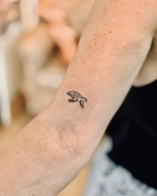 Tiny Black and Grey Turtle Tattoo on Women Arm by @bnanatattoo