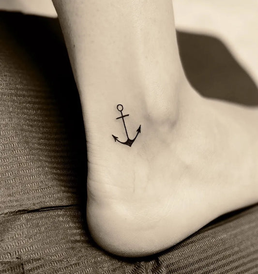 Tiny Blackwork Anchor Tattoo on Women Ankle by @annasebastiantattoo