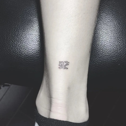 Tiny Blackwork Arabic Number Tattoo on Women Ankle by @jello_t