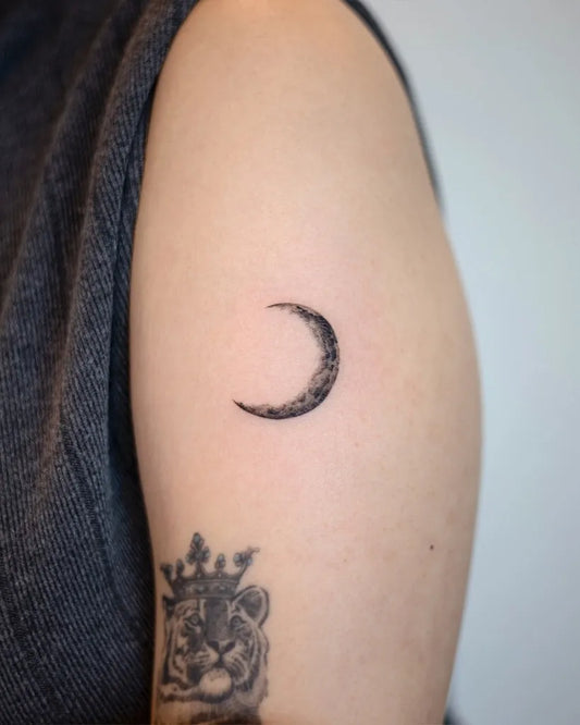 Tiny Blackwork Crescent Moon Tattoo on Women Arm by @handitrip