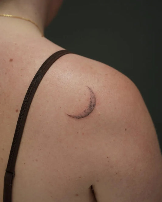 Tiny Blackwork Crescent Moon Tattoo on Women Shoulder by @romysant