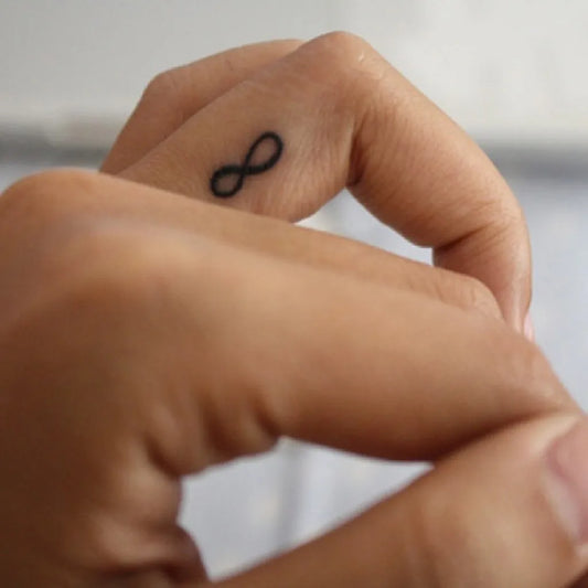 Tiny Blackwork Infinity Tattoo on Women Finger by @shoppingandfashion