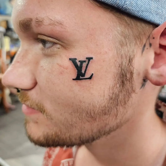 Tiny Blackwork LV Louis Vuitton logo on Men Face Tattoo by @creas99