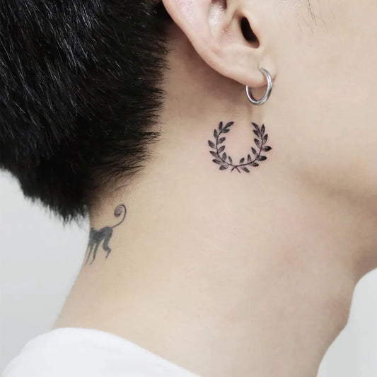 Tiny Blackwork Laurel Wreath Tattoo on Men Behind the Ear by @tattooist_soorim