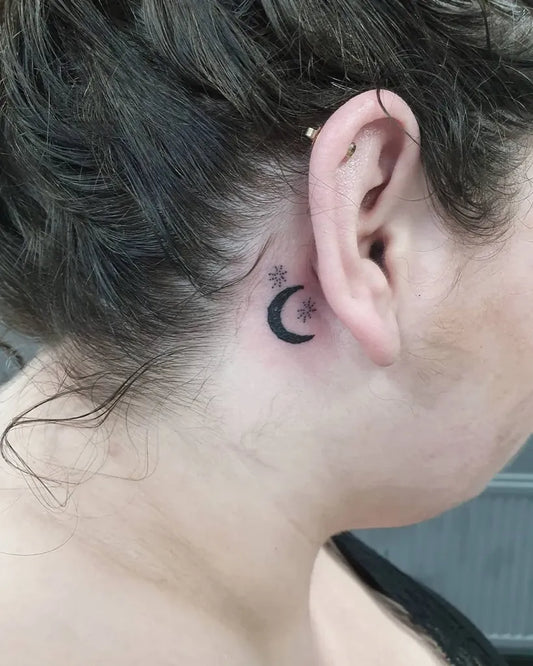 Tiny Blackwork Moon and Star Tattoo on Women Behind the Ear by @hannaeyetattoo
