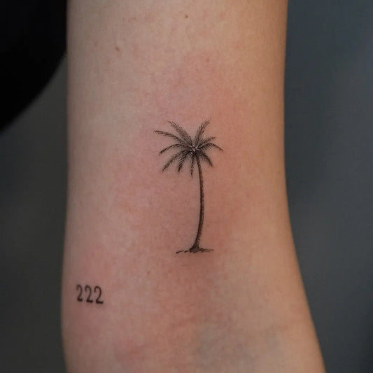 Tiny Blackwork Palm Tree Tattoo on Women Forearm by @tian_inker