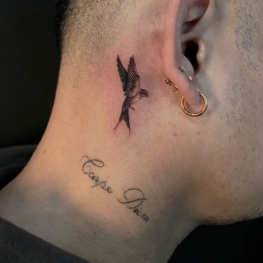 Tiny Blackwork Sparrow Tattoo on Men Behind The Ear by @cabramattaink