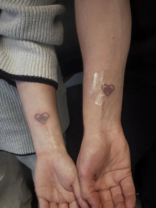 Tiny Celtic Heart Tattoo on Women Wrist by @mxttc_tattoo