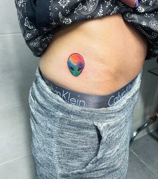 Tiny Colorful Alien Tattoo on Women Hip by @annasebastiantattoo