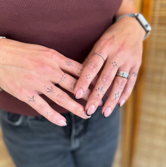 Tiny Delicate Dots Stars on Women Fingers Tattoo by @lucietattoo