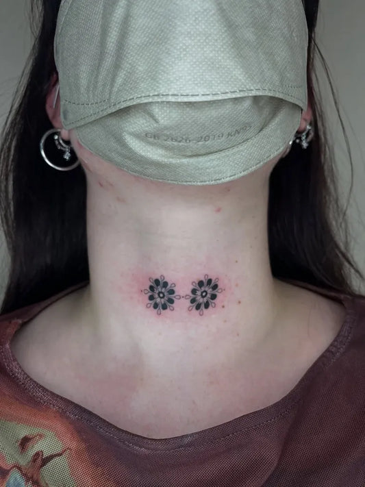 Tiny Dotwork Double Flowers on Women Neck Tattoo by @brujitatattoos