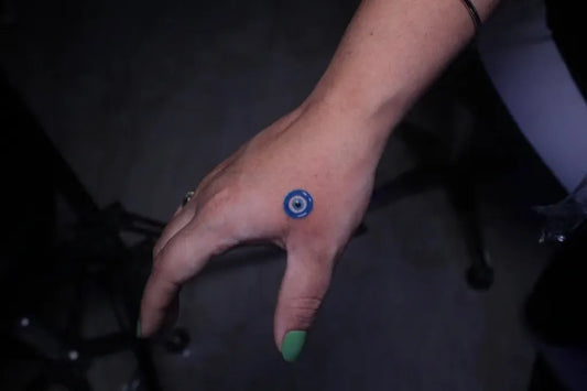 Tiny Dotwork Evil Eye on Women Hand Tattoo by @skingrafter