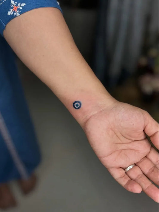 Tiny Dotwork Evil Eye on Women Wrist Tattoo by @kabirainktattooandpiercing
