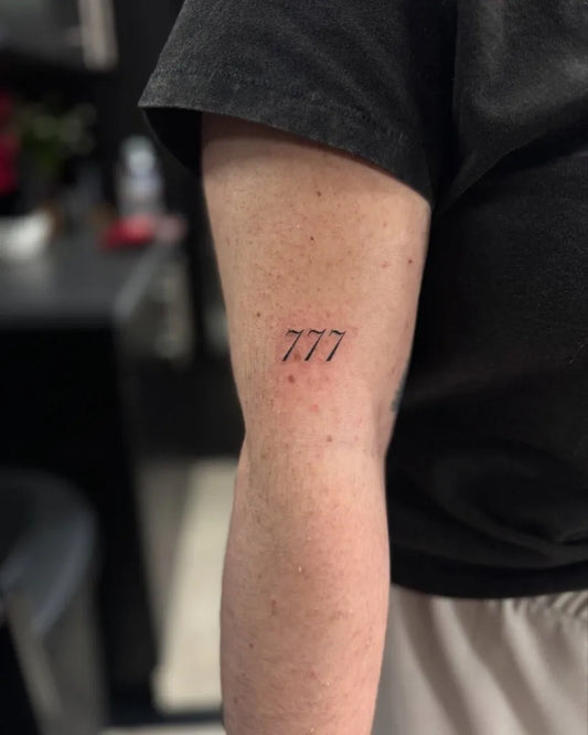 Tiny Fine Line 777 Tattoo on Men Arm by @toughmotherink