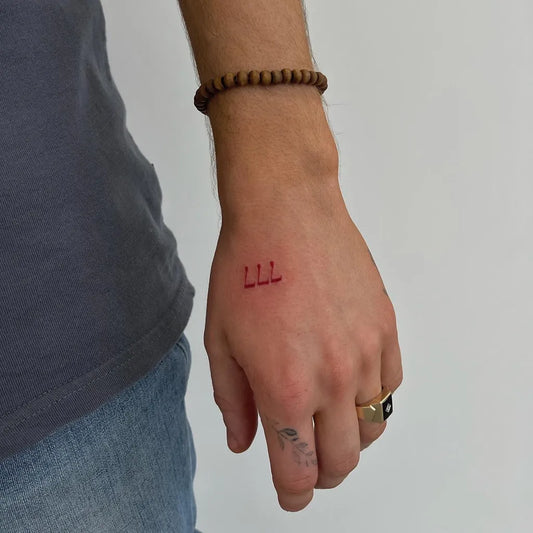 Tiny Fine Line 777 Tattoo on Men Hand by @teagantatt