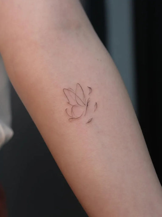 Tiny Fine Line Butterfly on Women Arm Tattoo by @cigdemozsy