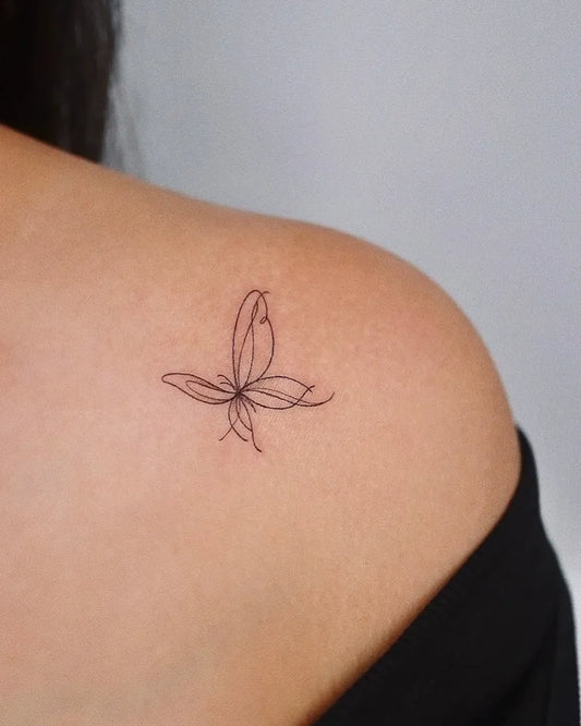 Tiny Fine Line Butterfly on Women Shoulder Tattoo by @tinytattooinc