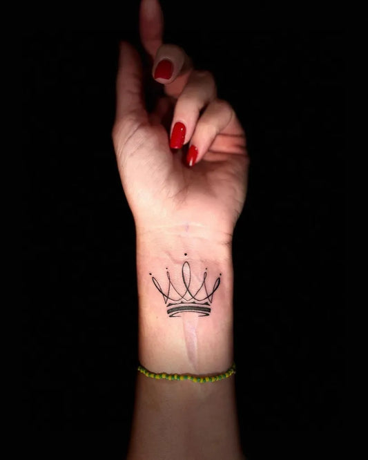 Tiny Fine Line Crown Tattoo on Women Wrist by @tattzbychriss
