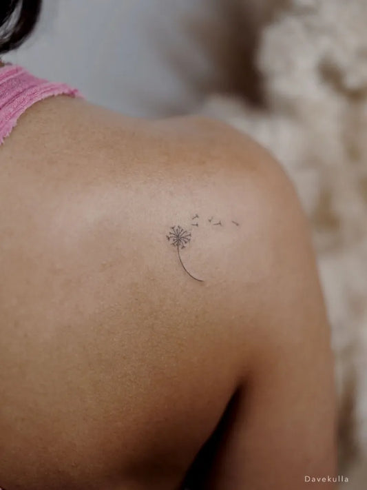 Tiny Fine Line Dandelion Tattoo on Women Shoulder by @davekulla.ta