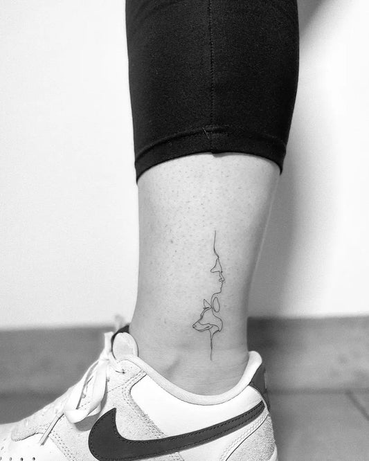 Tiny Fine Line Dog Tattoo on Women Ankle by @a.fineline.tattoo