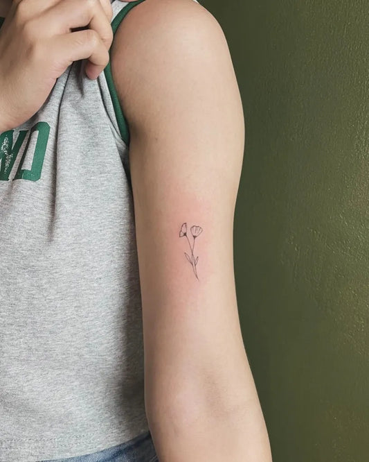 Tiny Fine Line Dove Flowers Tattoo on Women Arm by @theneedlemnl