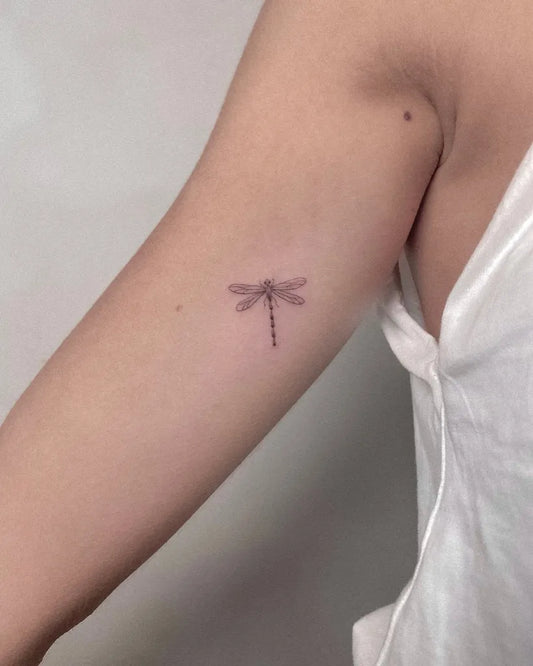 Tiny Fine Line Dragonfly on Women Arm Tattoo by @elvis_pachamamatattoo