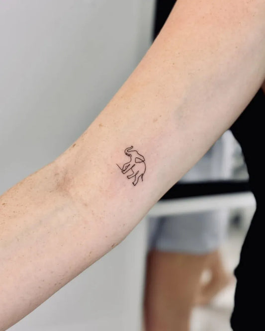 Tiny Fine Line Elephant Tattoo on Women Forearm by @bnanatattoo